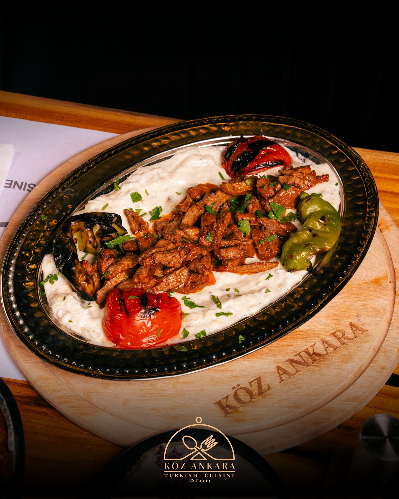 Charcoal kebab over smoked yogurt